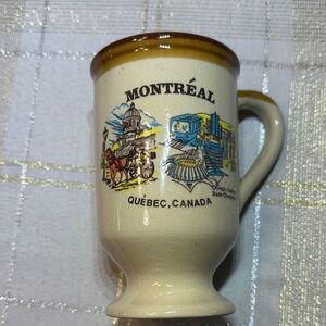 Vintage ceramic souvenir coffee mug with illustration of Montreal Quebec OS